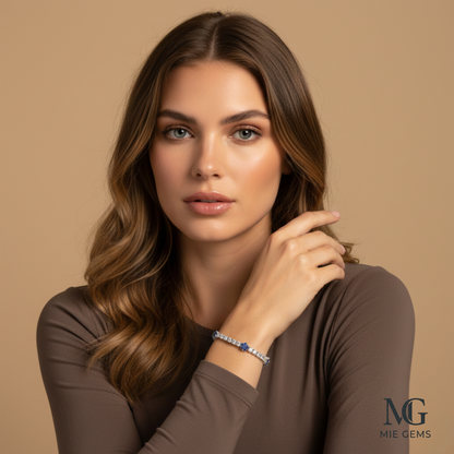 Woman wearing a bracelet with a beige background